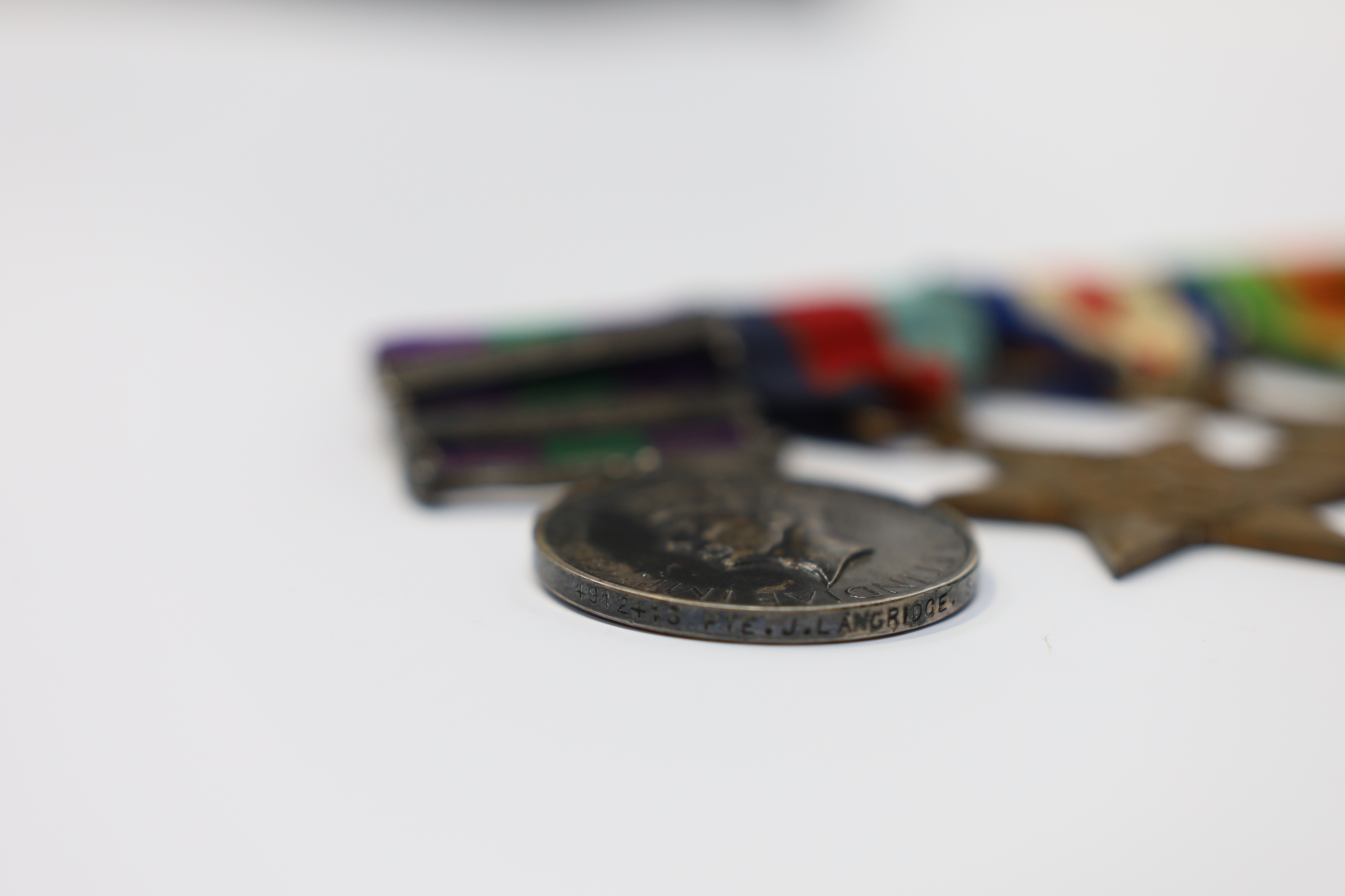 A WWII medal group awarded to Pte. J. Langridge S. Staff, comprising; a General Service Medal with two bars for Palestine and Palestine 1945-48, stamped to the edge with the recipient’s details, together with a 1939-45 S